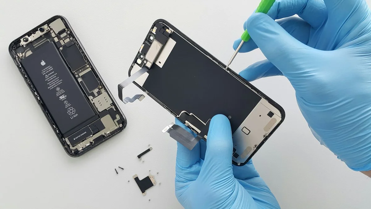 Gloved hands carefully replacing a mobile phone screen